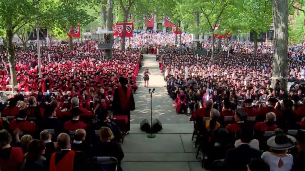 A crowd of Harvard students and teachers at a commencement speech