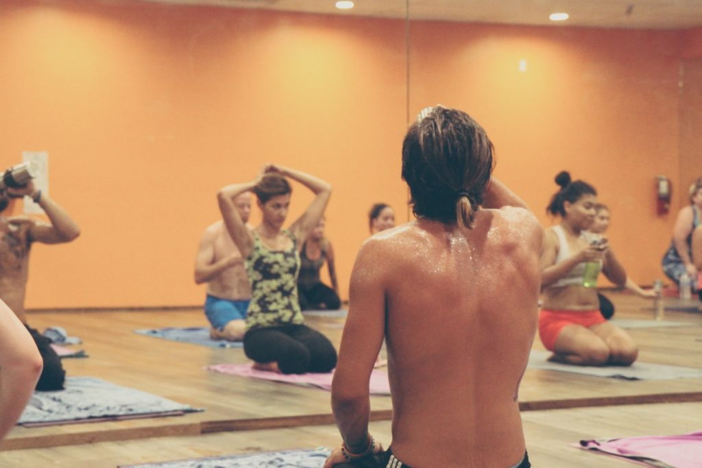 Members of a busy yoga-class sitting